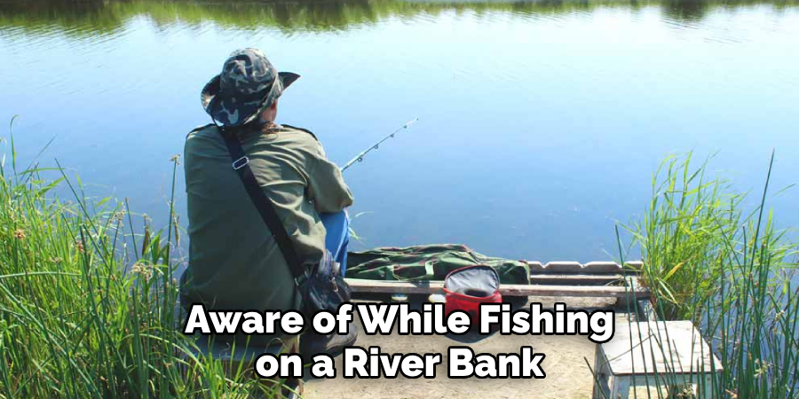 Aware of While Fishing on a River Bank