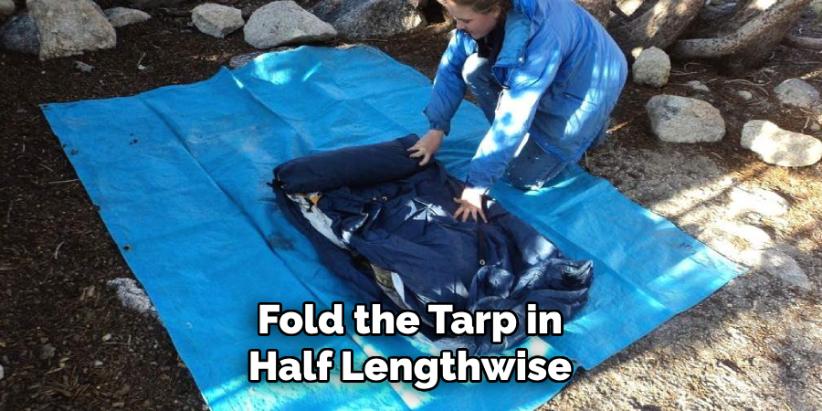 Fold the Tarp in Half Lengthwise