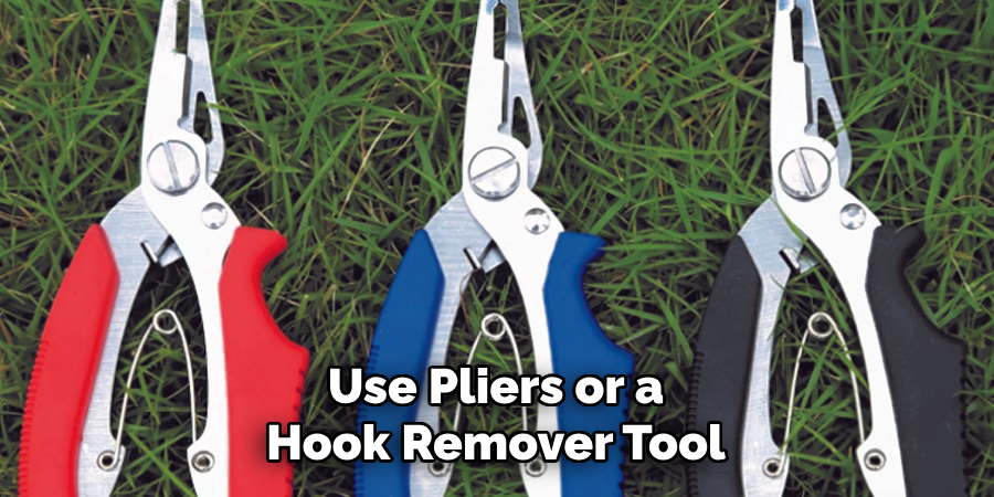 Use Pliers or a Hook Remover Tool