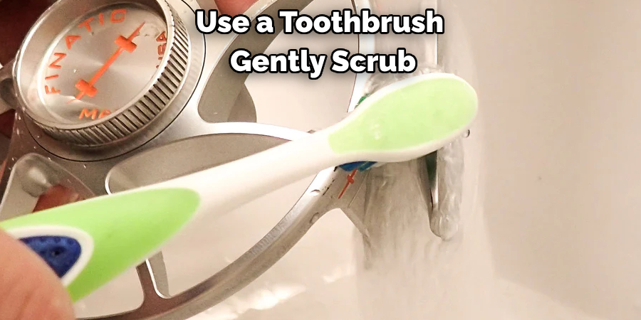 Use a Toothbrush Gently Scrub