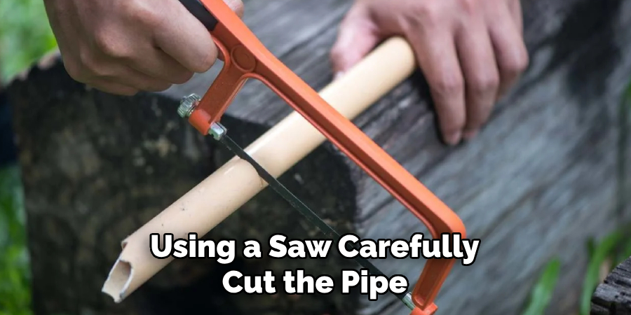 Using a Saw Carefully Cut the Pipe